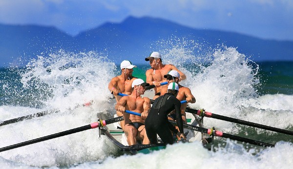 Titahi Bay men's surf boat crew on their way to victory in Waihi yesterday.